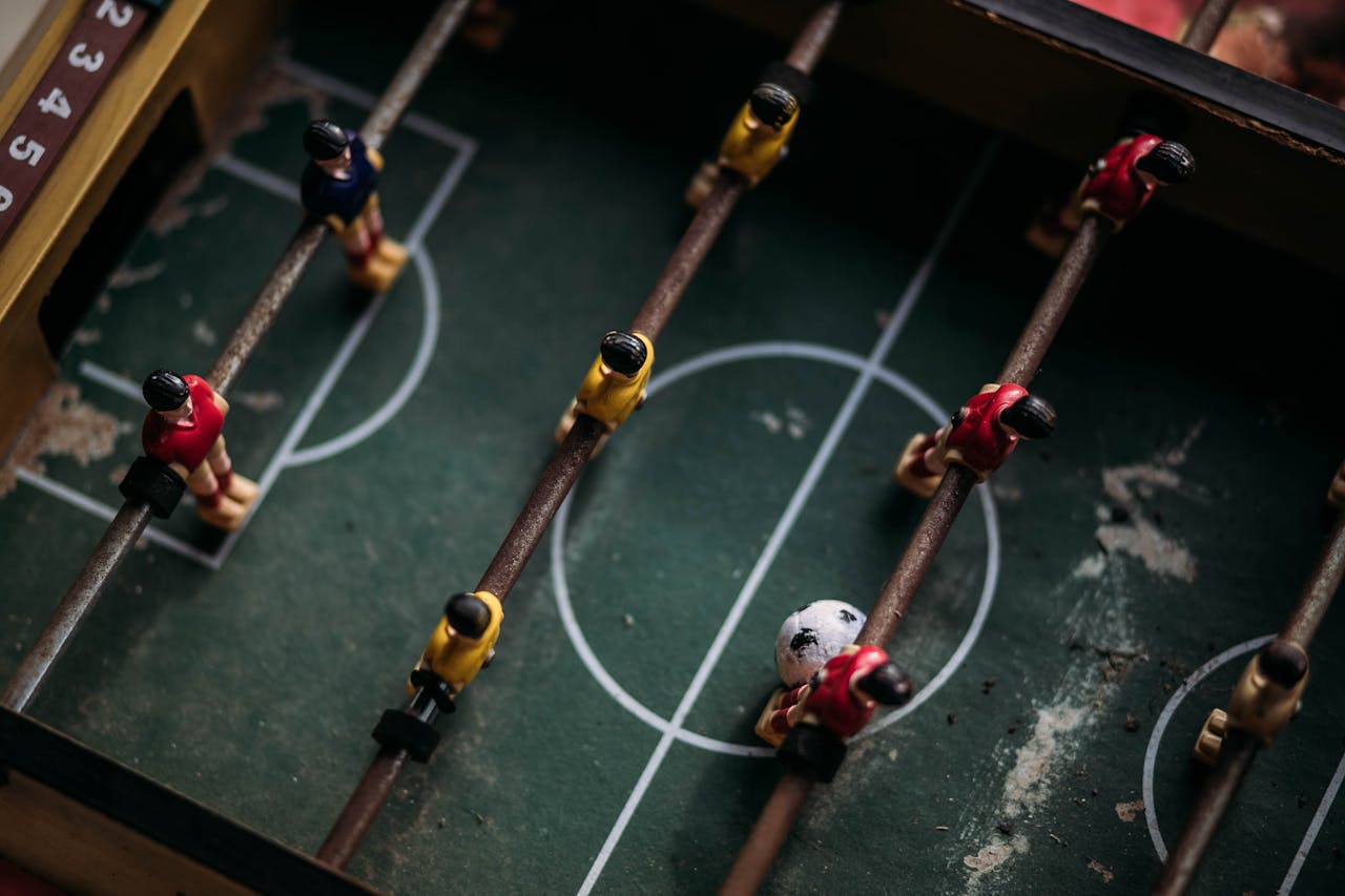 Close-up and Top Photography of Football Table